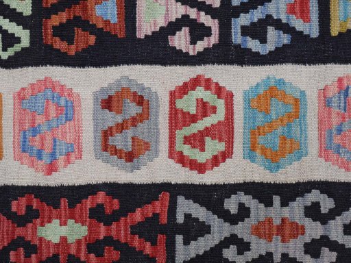 Backside of handmade New Modern Design rug showing knot structure and weave density