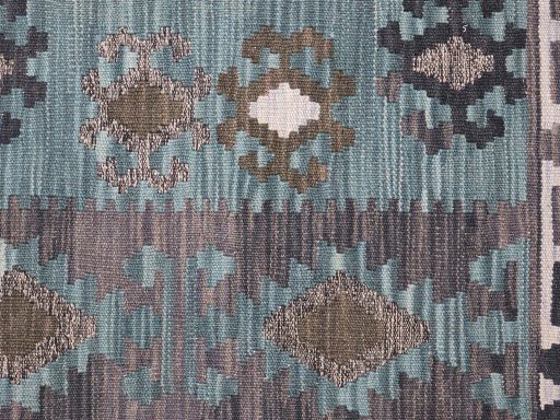 Backside of handmade New Modern Design rug showing knot structure and weave density