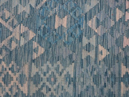 Backside of handmade New Modern Design rug showing knot structure and weave density
