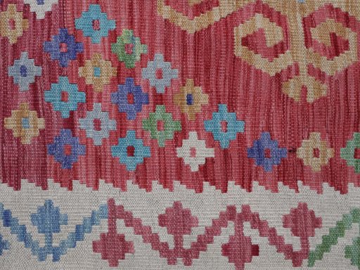Backside of handmade New Modern Design rug showing knot structure and weave density
