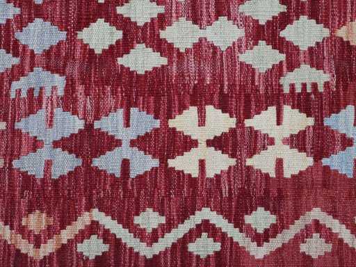 Backside of handmade New Modern Design rug showing knot structure and weave density