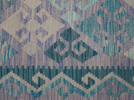 Backside of handmade New Modern Design rug showing knot structure and weave density