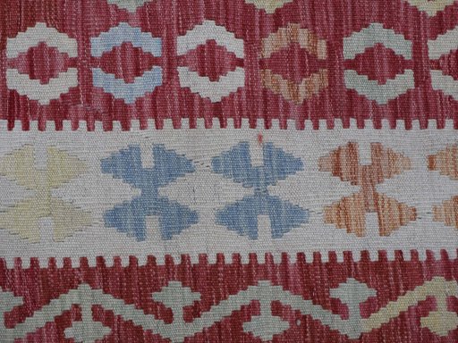 Backside of handmade New Modern Design rug showing knot structure and weave density