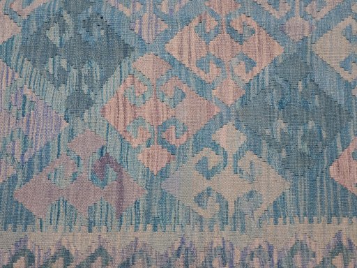 Backside of handmade New Modern Design rug showing knot structure and weave density