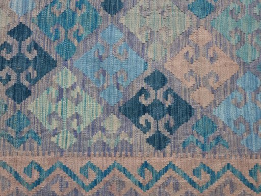 Backside of handmade New Modern Design rug showing knot structure and weave density