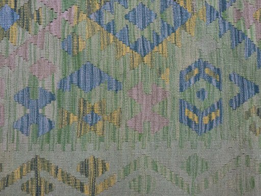 Backside of handmade New Modern Design rug showing knot structure and weave density