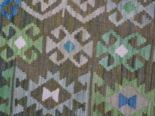 Backside of handmade New Modern Design rug showing knot structure and weave density
