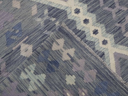 Surface texture of New Modern Design rug with natural Wool and intricate pattern