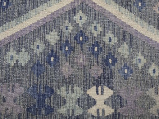 Backside of handmade New Modern Design rug showing knot structure and weave density