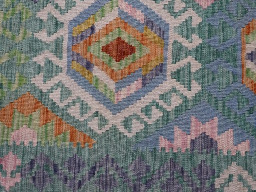 Backside of handmade New Modern Design rug showing knot structure and weave density