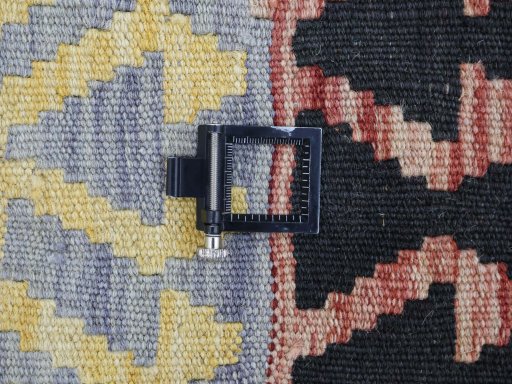 Corner detail of New Modern Design rug showing border pattern and Wool pile