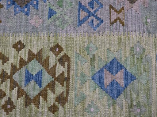 Backside of handmade New Modern Design rug showing knot structure and weave density