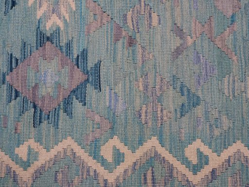 Backside of handmade New Modern Design rug showing knot structure and weave density