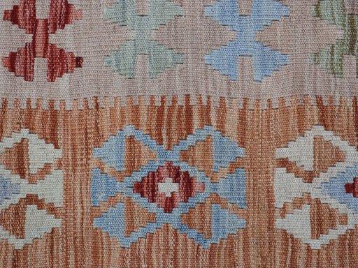 Backside of handmade New Modern Design rug showing knot structure and weave density