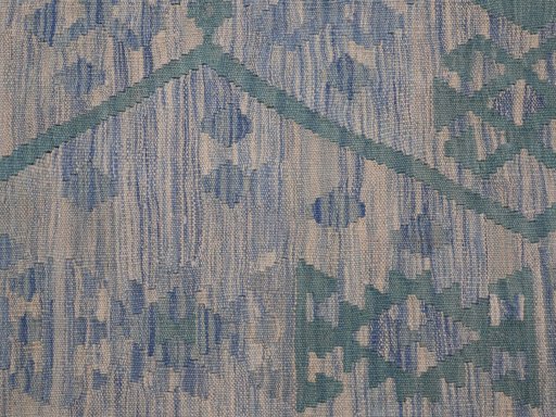 Backside of handmade New Modern Design rug showing knot structure and weave density
