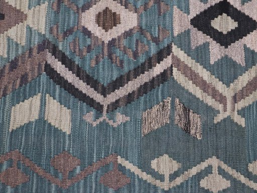 Backside of handmade New Modern Design rug showing knot structure and weave density
