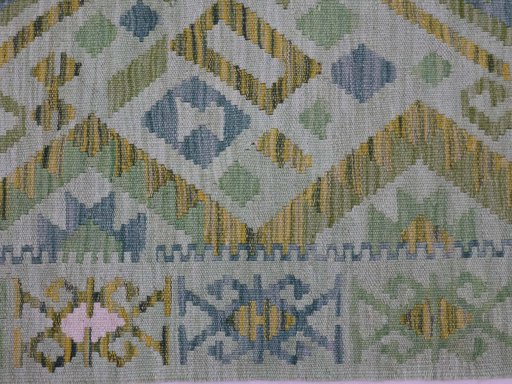 Backside of handmade New Modern Design rug showing knot structure and weave density