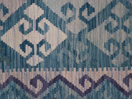 Backside of handmade New Modern Design rug showing knot structure and weave density