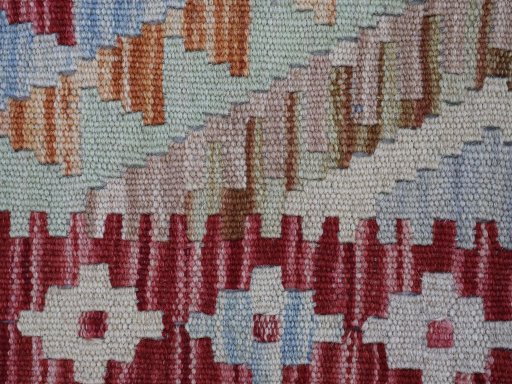 Backside of handmade New Modern Design rug showing knot structure and weave density