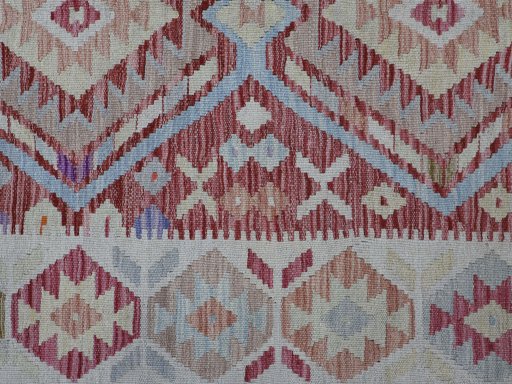 Backside of handmade New Modern Design rug showing knot structure and weave density