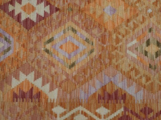 Backside of handmade New Modern Design rug showing knot structure and weave density