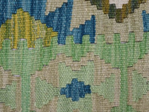 Backside of handmade New Modern Design rug showing knot structure and weave density