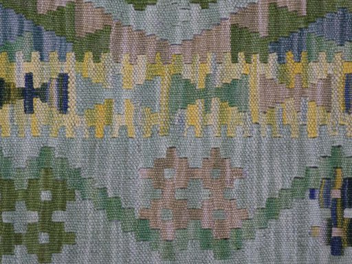 Backside of handmade New Modern Design rug showing knot structure and weave density