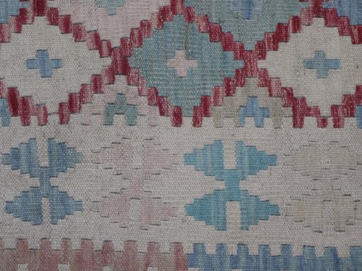 Backside of handmade New Modern Design rug showing knot structure and weave density