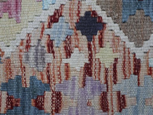 Backside of handmade New Modern Design rug showing knot structure and weave density