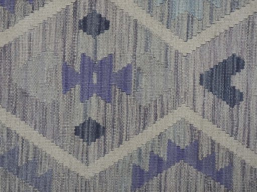 Backside of handmade New Modern Design rug showing knot structure and weave density