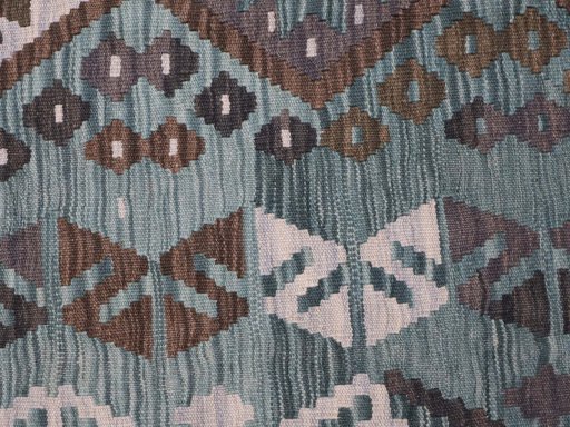 Backside of handmade New Modern Design rug showing knot structure and weave density