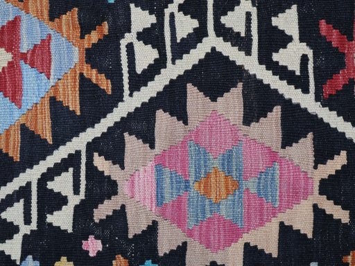 Backside of handmade New Modern Design rug showing knot structure and weave density