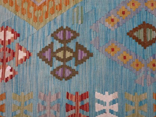 Backside of handmade New Modern Design rug showing knot structure and weave density