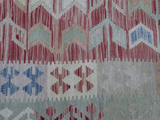 Backside of handmade New Modern Design rug showing knot structure and weave density