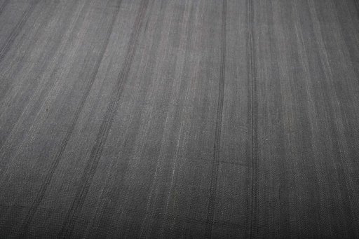 Backside of handmade New Modern Design rug showing knot structure and weave density
