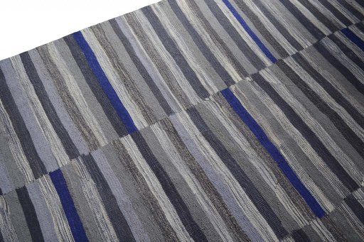 Backside of handmade New Modern Design rug showing knot structure and weave density