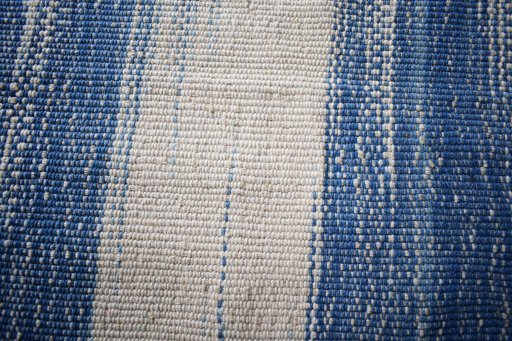 Backside of handmade New Modern Design rug showing knot structure and weave density