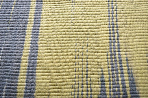 Backside of handmade New Modern Design rug showing knot structure and weave density