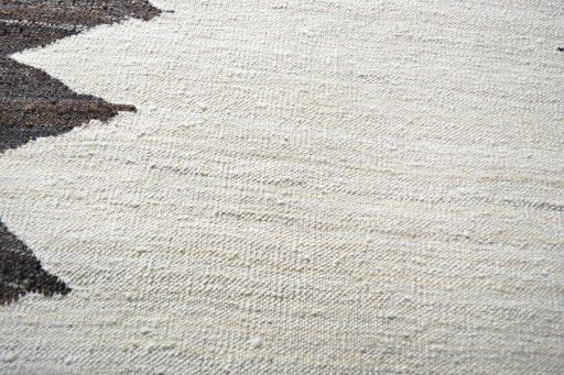 Backside of handmade New Modern Design rug showing knot structure and weave density