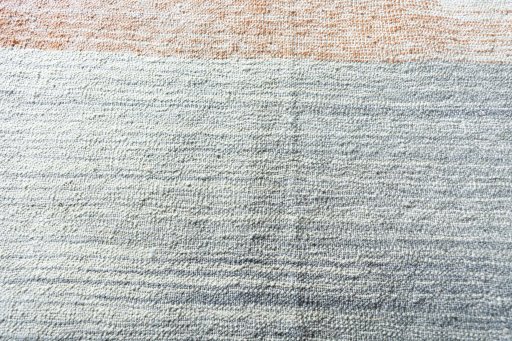 Backside of handmade New Modern Design rug showing knot structure and weave density