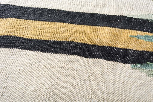 Backside of handmade New Modern Design rug showing knot structure and weave density