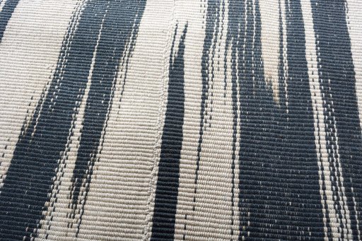 Backside of handmade New Modern Design rug showing knot structure and weave density