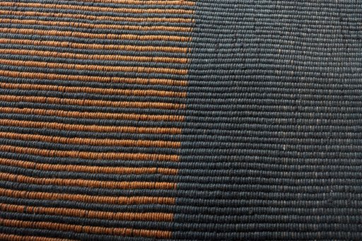 Backside of handmade New Modern Design rug showing knot structure and weave density