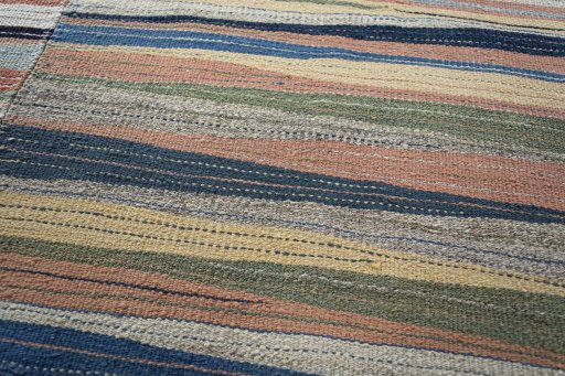 Backside of handmade New Modern Design rug showing knot structure and weave density