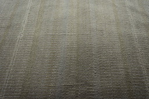 Backside of handmade New Modern Design rug showing knot structure and weave density