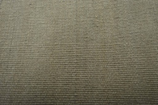 Backside of handmade New Modern Design rug showing knot structure and weave density