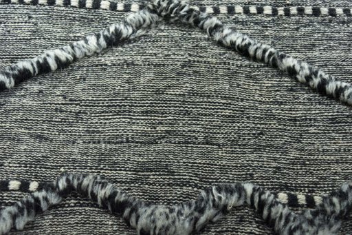 Backside of handmade New Modern Design rug showing knot structure and weave density