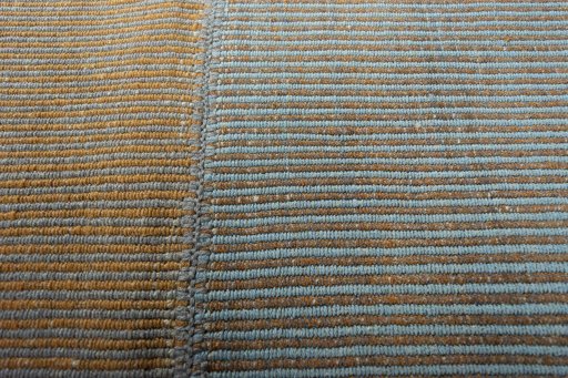 Backside of handmade New Modern Design rug showing knot structure and weave density