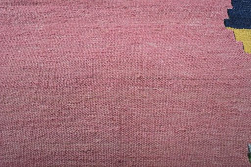 Backside of handmade New Modern Design rug showing knot structure and weave density