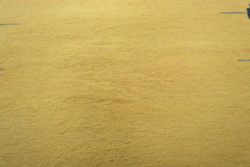 Backside of handmade New Modern Design rug showing knot structure and weave density